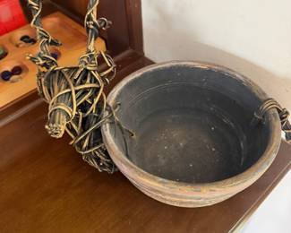 Primitive wood dough bowl with woven rattan decorative figure