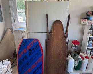 Wave Action bodyboard and vintage wood ironing board in garage