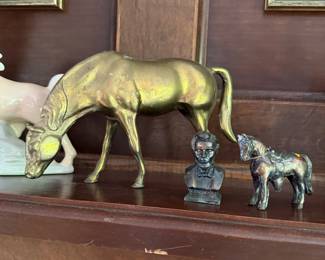 Brass grazing horse figurine with small bronze horse and bust figures