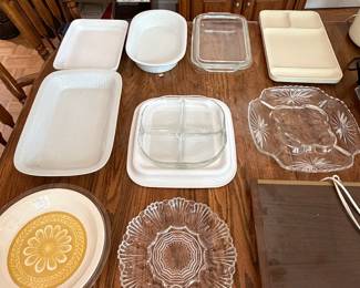 Serveware lot with glass divided relish trays, ceramic baking dishes and wood serving board