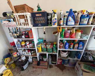 Garage shelving with lawn and garden chemicals, paint, cleaning supplies and yard care products