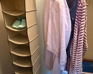 Closet with hanging shoe organizer, robes and scarves