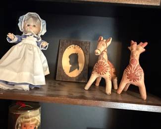 Bonnet doll, framed silhouette portrait and pair of Mexican folk art pottery deer figures