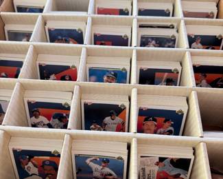 Baseball card collection sorted in divided storage boxes