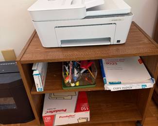 HP inkjet printer on rolling wood cart with office and copy paper supplies