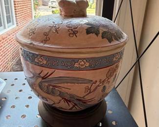 Southwestern style painted pottery lidded jar with bird and leaf motif