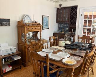 Dining room with oak dining table, spindle back chairs and china hutch