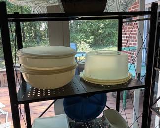 Vintage Tupperware storage containers and cake carrier on baker's rack