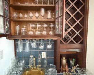 Built in wet bar with wine rack, stemware, barware and cocktail shakers