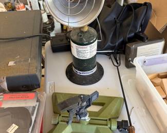 Garage workbench with shop light, vintage green miter box and hand tools