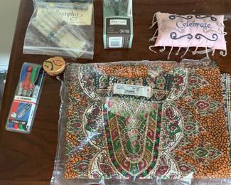 Paisley print table linens, Celebrate throw pillow, taper candles and markers