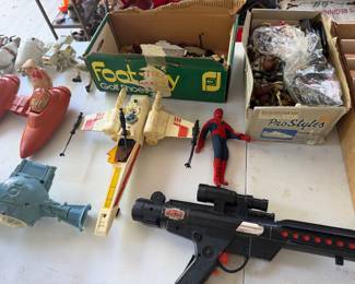 Vintage toys including Spider-Man figure, toy blaster and assorted space vehicles