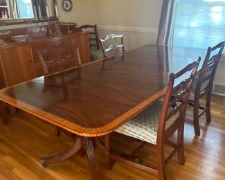 Large, handsome mahogany dining table with decorative edge banding around the entire tabletop. In Clyde's 2 leaves and 2 table pads. 44" x 8' extended. 44" x 4'4" closed