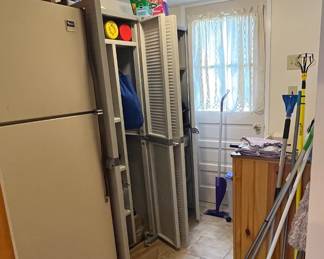 Whirlpool fridge two Black & Decker cabinets, cleaning supplies