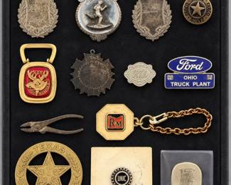 assorted vintage pins, badges, and medallions, including a Ford Ohio Truck Plant oval tag and various fraternal items