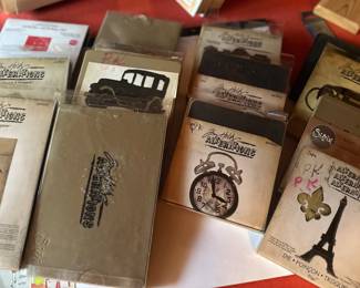a collection of Tim Holtz Idea-ology and Sizzix papercrafting and vintage-style ephemera