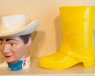 vintage Roy Rogers cowboy hat character cup made by F&F Mold & Die Works alongside a yellow plastic novelty cowboy boot