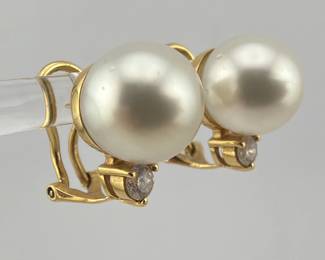 Pair of 18kt gold, diamond and 11mm pearl earrings