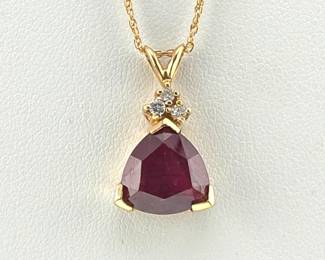 14kt necklace with trillion cut ruby and diamond pendant
