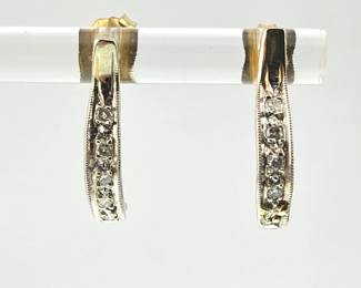 Pair of 14kt white gold diamond earrings