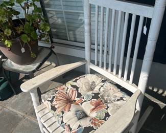 One of a pair of painted wooden rocking chairs