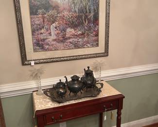 Small server with a full tea service along with floral art