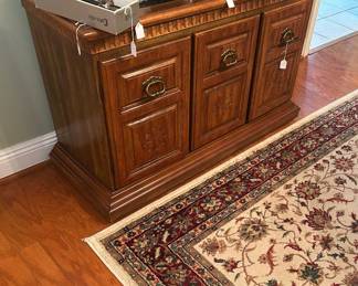 Low server and large Persian-style rug