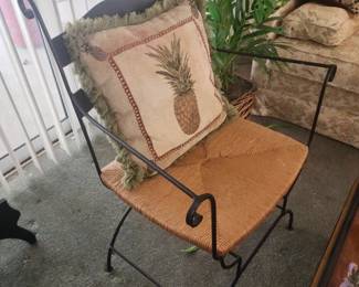 Metal framed chair with wicket seat