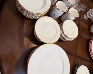 Wallace Dinnerware Collection– Wallace dinnerware featuring a classic white design with gold trim. Includes dinner plates, salad plates, bowls, mugs, serving platters, and additional coordinating pieces. A timeless collection for everyday dining or special occasions. Items sold individually unless noted.