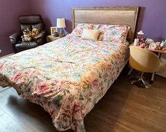 Bedroom Furniture Collection – Queen-size bed with a wood headboard, upholstered accent chair, leather recliner, nightstand, side table, table lamps, and decorative accessories. A coordinated collection suitable for a primary or guest bedroom. Items sold individually unless noted.