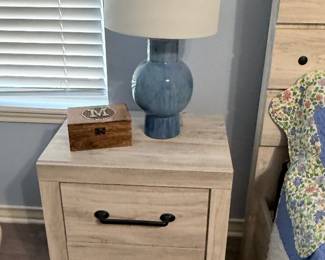 Blue Ceramic Table Lamp – Contemporary ceramic table lamp featuring a blue glazed base and a white drum shade. A versatile accent piece for a bedroom, living room, or office. Sold as found.