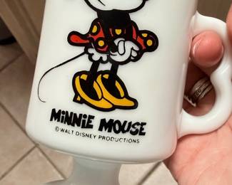 **Vintage Mickey Mouse Milk Glass Pedestal Mug** – Vintage Walt Disney Productions milk glass pedestal mug featuring Mickey Mouse artwork and an easy-grip handle. A fun collectible for Disney fans or vintage mug collectors. Sold as found.