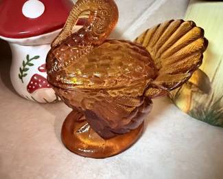 Amber Glass Turkey Covered Dish – Vintage amber glass covered dish in the shape of a turkey with detailed feather design. A classic serving piece for Thanksgiving, fall décor, or vintage glass collections. Sold as found.
