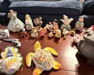 Crystal-style table lamp, Disney collectibles, angel figurines, decorative crosses, trinket dishes, ceramic turtle, novelty "Beer Money" jar, toy cap gun, and assorted tabletop décor. Items sold individually unless noted.