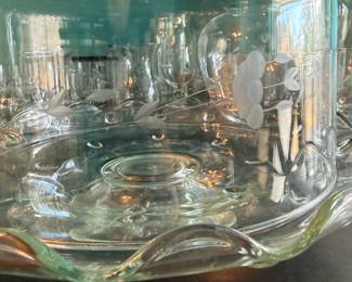 **Princess House Crystal Cake Stand with Dome** – Princess House crystal cake stand with matching domed cover, featuring an etched floral pattern and scalloped edge. An elegant serving piece for cakes, pastries, or special occasions. Sold as found.