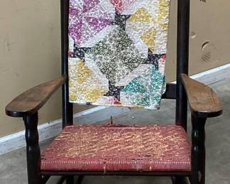 VTG. ROCKING CHAIR w TURNED SPINDLES, WOVEN SEAT WITH VTG. QUILT NO SHIPPING PICKUP ONLY