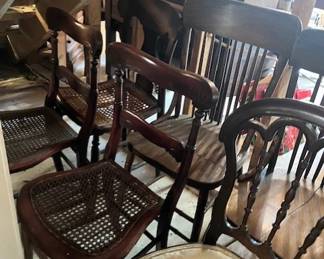 Many antique chairs.