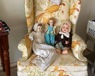 Matching chair, more antique dolls