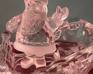 #167 - $70 - Swarovski Santa in a sleigh and a sitting little girl