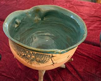 #18 - $75 - Handmade terracotta bowl & teal glaze resting on a natural branch stand.