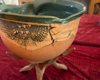 #18 - $75 - Handmade terracotta bowl & teal glaze resting on a natural branch stand.