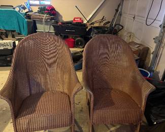 #98 - $100 - Pair of brown woven wicker armchairs with high rounded backs