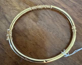#121 - $450 - 14kt gold bangle with wire wrapp on top - 5.83gr