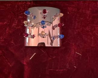 #173 - $70 - Swarovski set of 9 mini tulips in stand