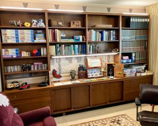 Custom freestanding walnut bookshelves are available! There are 4 total, with 2 on each wall
