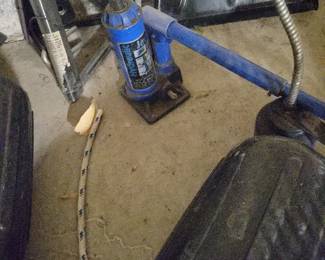 There are 3 bottle jacks of different sizes