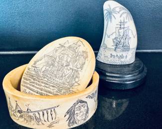 Left to right ( $60 - Scrimshaw on bone trinket box - 4.5” wide x 2” tall) ($30 - Decorative replica of a scrimshaw whale tooth - 4”x 4”)