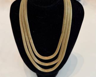 $58 - triple strand gold necklace.