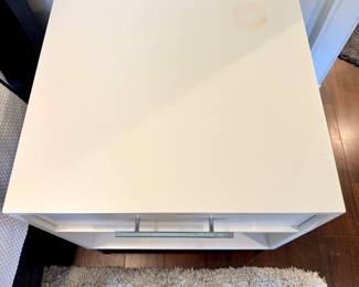 Image of the top of one of the nightstands with slight discoloration on top right.