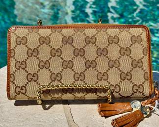 $480 - Gucci wallet, approximately 7.5" X 4"